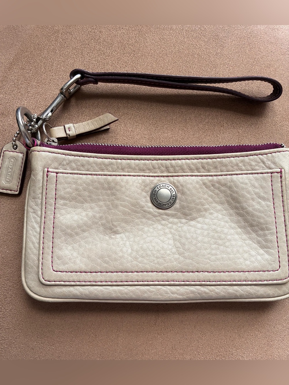 Coach Cream Leather Wristlet with purple Stitching, Lining and Zip